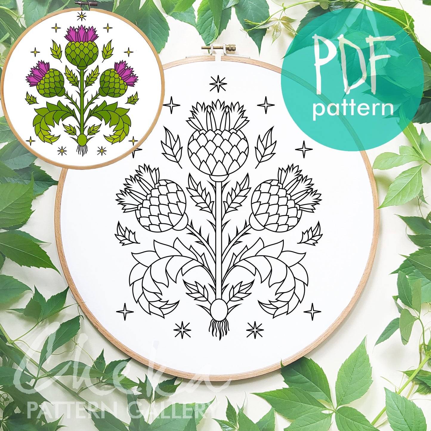 Embroidery hoop with thistle pattern design and PDF pattern label on green leaf background