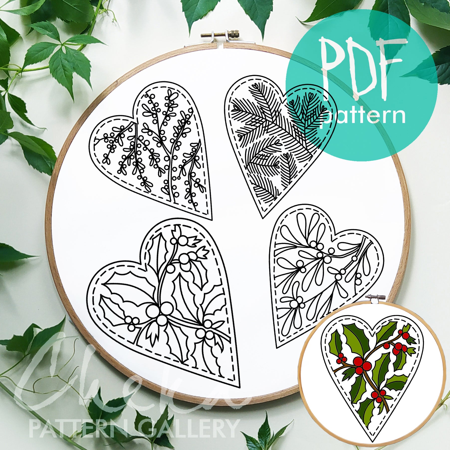 Embroidery hoop with heart-shaped designs and a PDF pattern label.