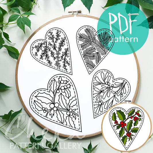 Embroidery hoop with heart-shaped designs and a PDF pattern label.