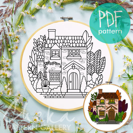 Embroidery hoop with house design, surrounded by flowers and plants, with 'PDF pattern' label.