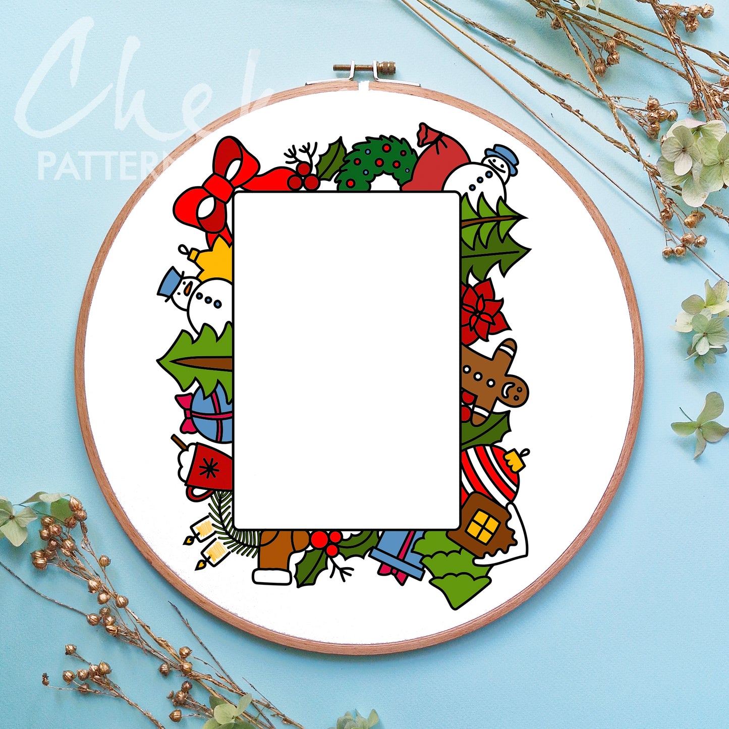 Embroidery hoop with a colorful Christmas-themed border on a light blue background