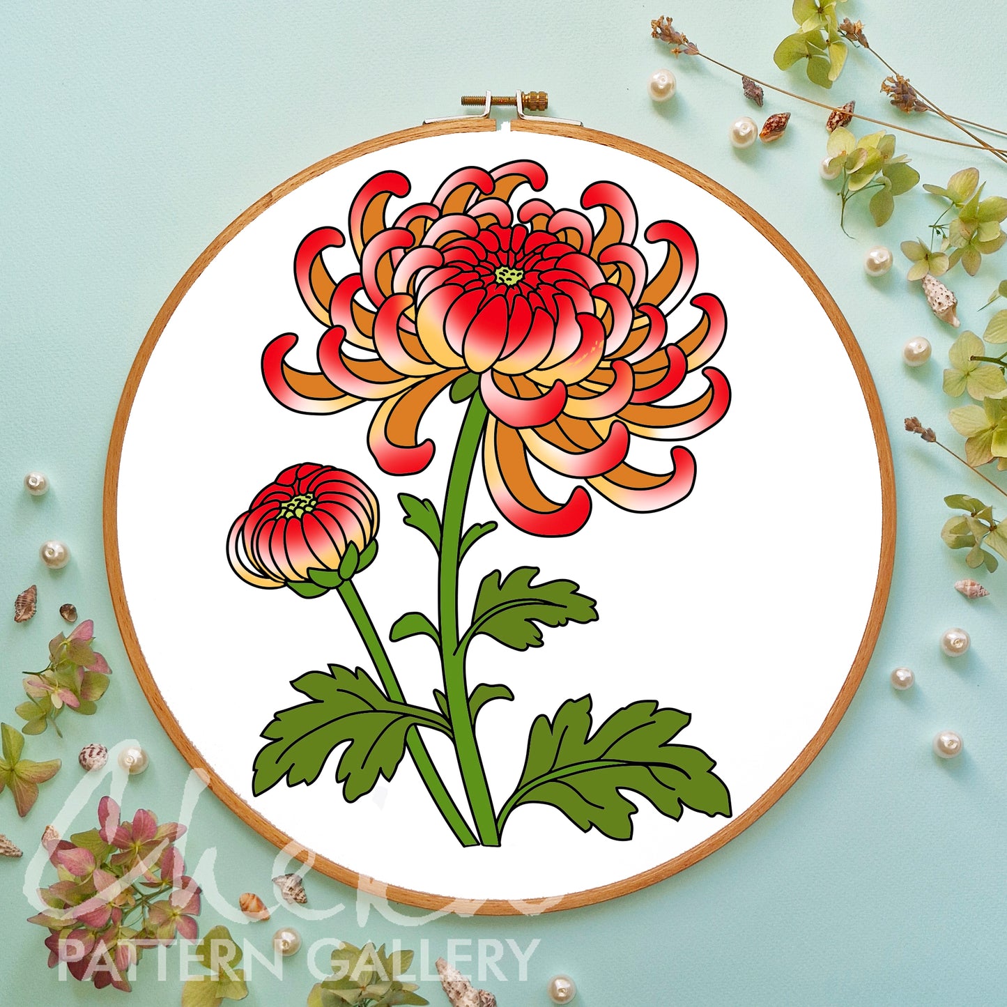 Floral embroidery design in a wooden hoop on a light blue background with floral decorations.