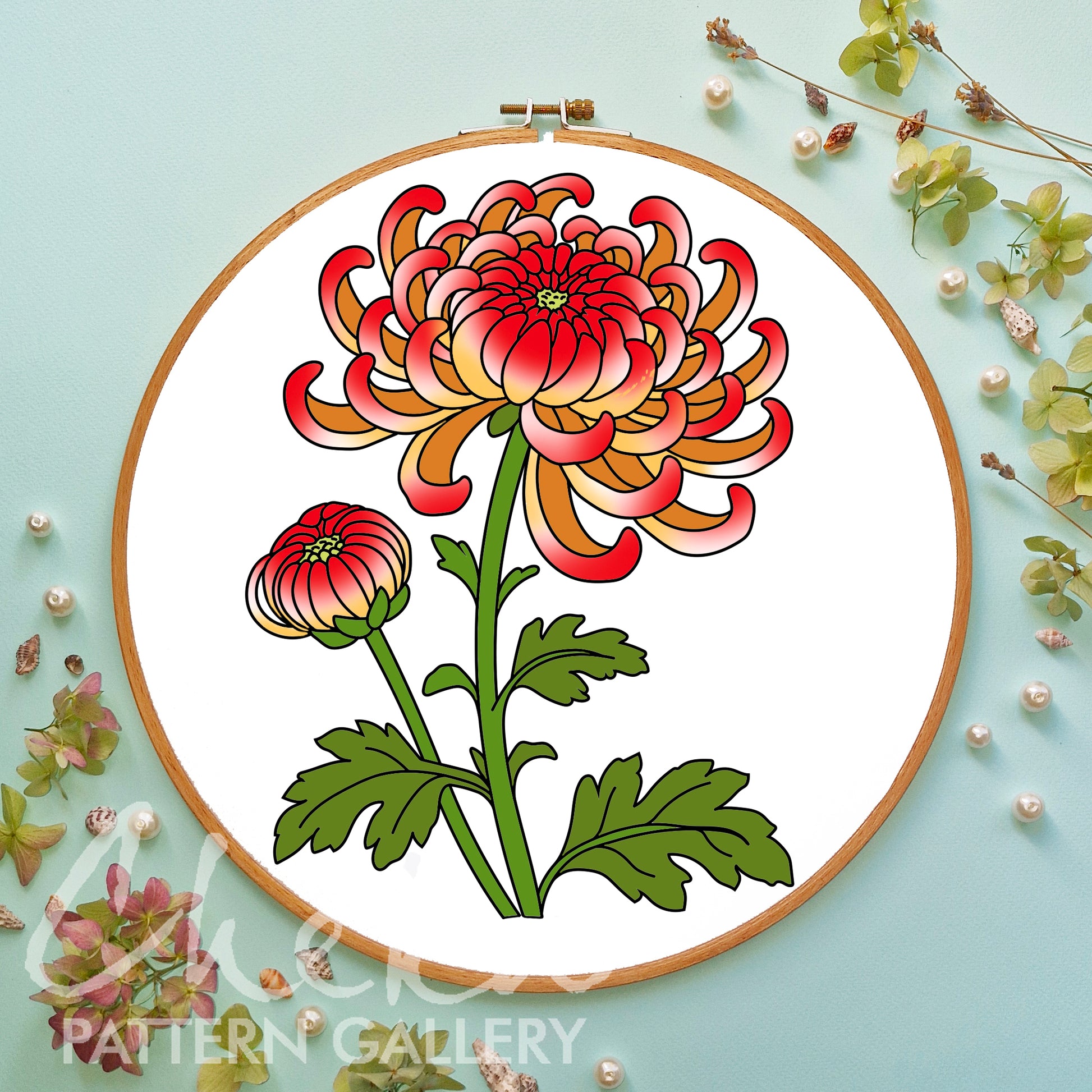 Floral embroidery design in a wooden hoop on a light blue background with floral decorations.