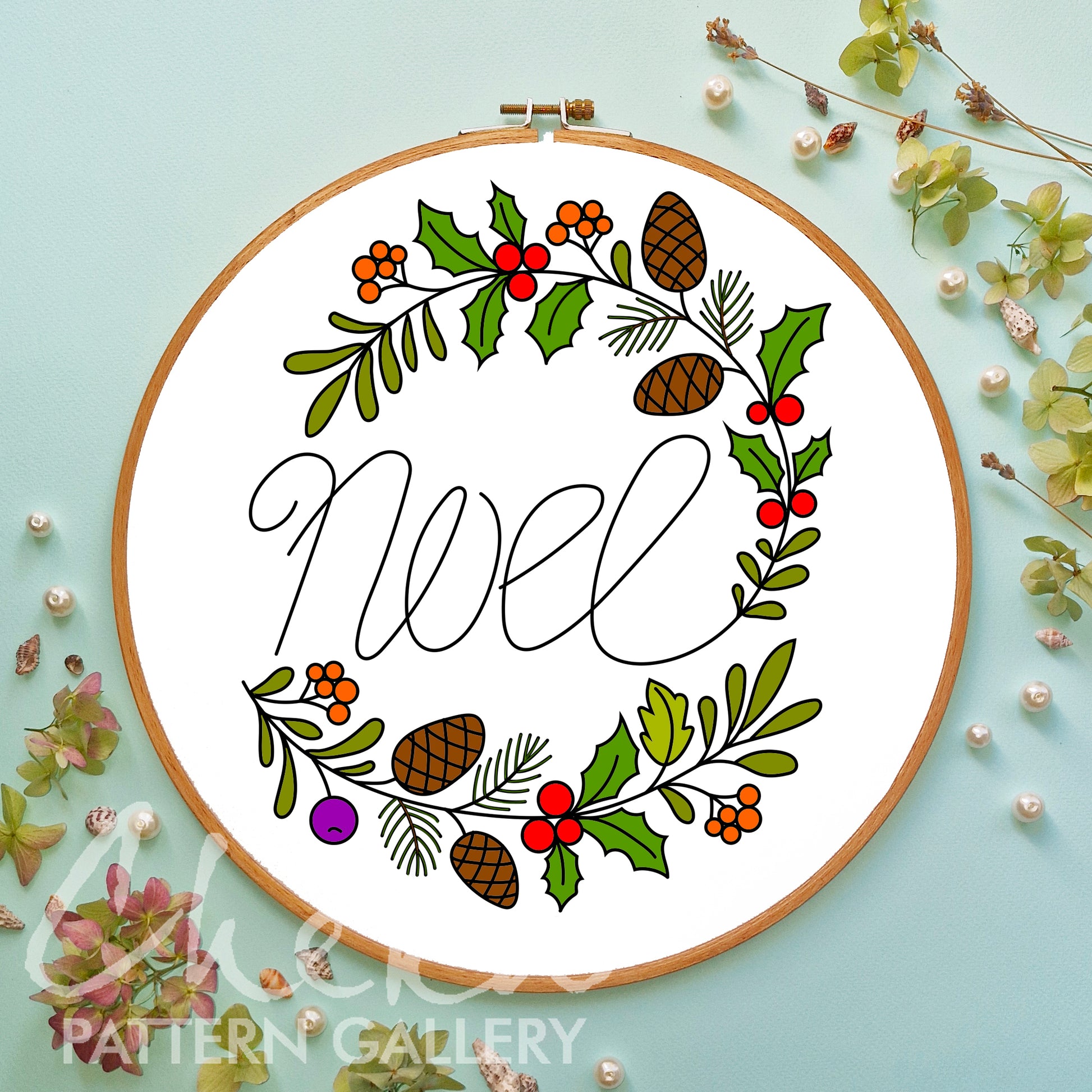 Decorative hoop with 'Mistletoe' design on a light blue background