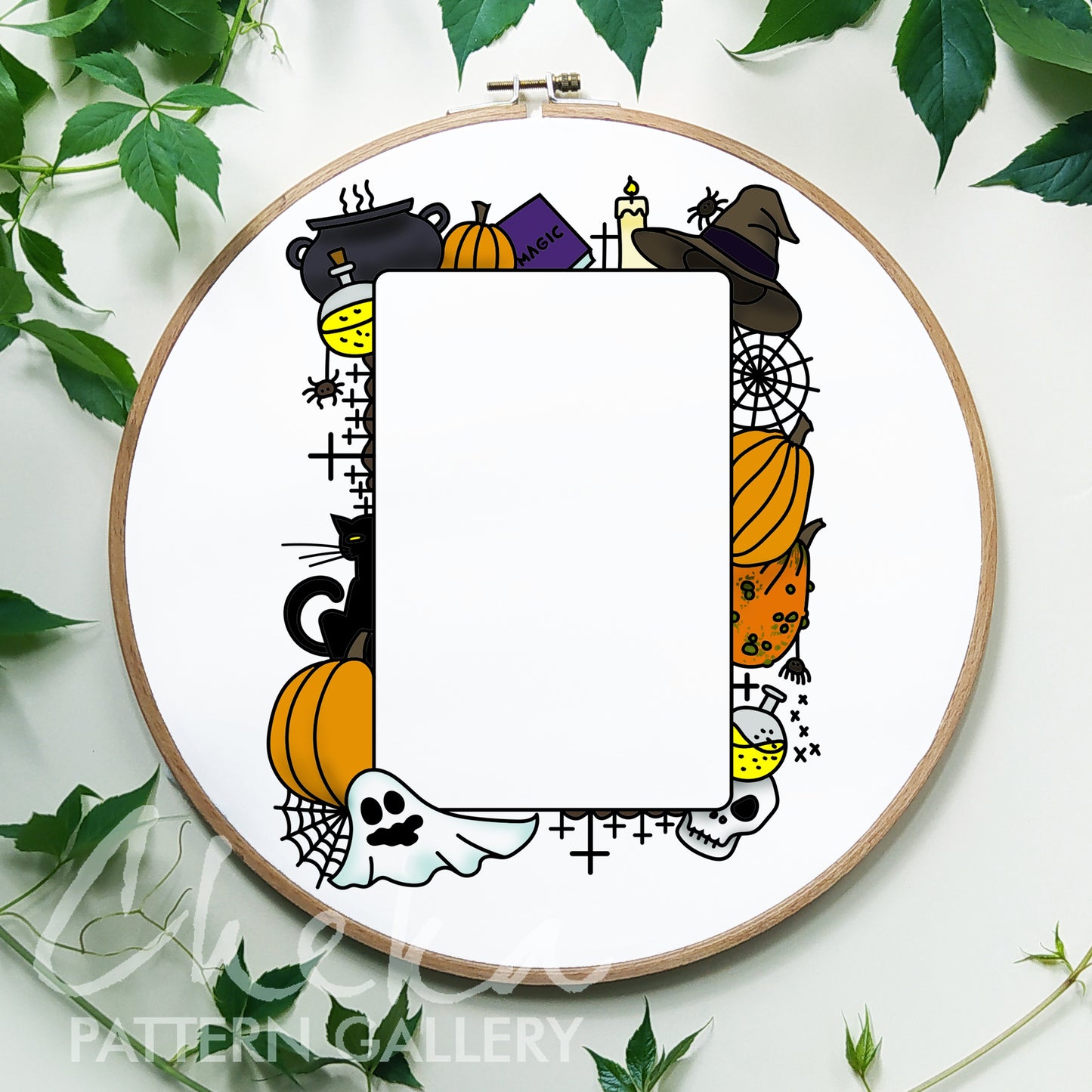Halloween-themed embroidery hoop with pumpkins, ghosts, and witches' hats on a white background.